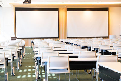 Empty chairs and tables in cafe