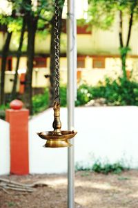 Close-up of chain hanging on pole in park