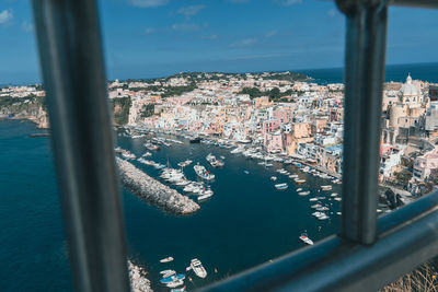 High angle view of buildings and sea seen through window