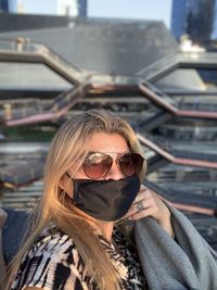 Portrait of young woman wearing sunglasses