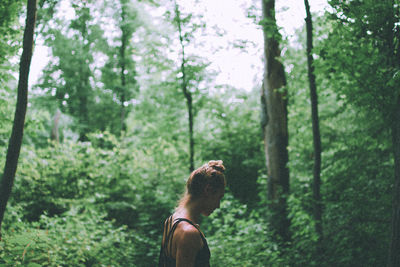 Low section of woman in forest