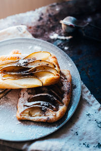 High angle view of apple pie in plate on table