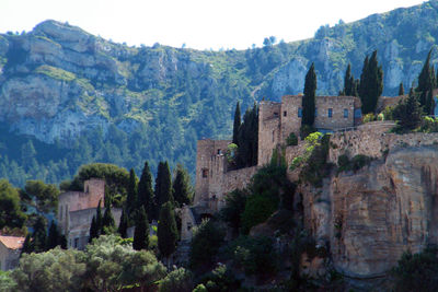 Castle on mountain against sky