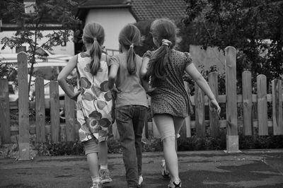 Rear view of couple walking outdoors