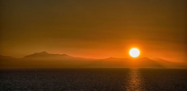 Scenic view of seascape against sky during sunset