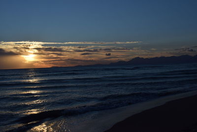 Scenic view of beach at sunset