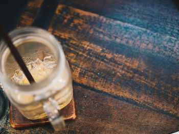 High angle view of ice cubes in glass jar on table