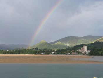 Scenic view of mountains against cloudy sky