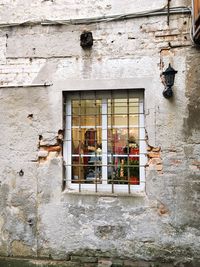 Low angle view of window on old building