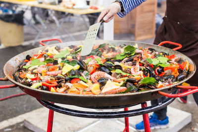 Man preparing food on barbecue grill