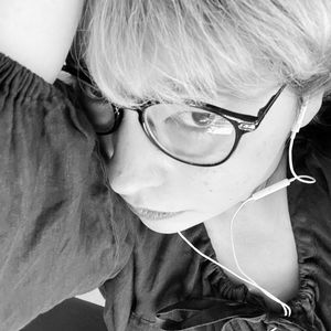 Close-up portrait of woman wearing eyeglasses