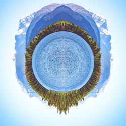 Digital composite image of mountain against sky
