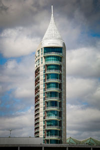 Low angle view of building against cloudy sky