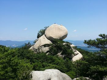 Low angle view of rocky mountain against sky