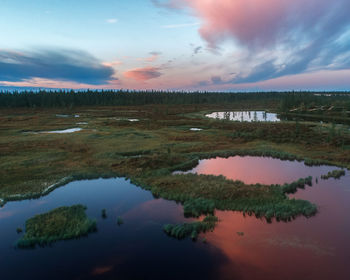 Scenic view of lake against sky during sunset