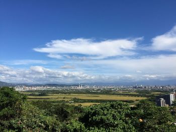 High angle view of trees and buildings against sky