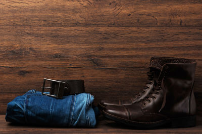 Low section of man photographing with camera on table