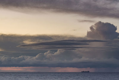 Scenic view of sea against sky at sunset