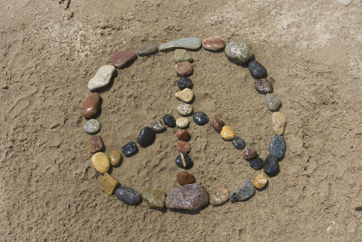 High angle view of heart shape on rock