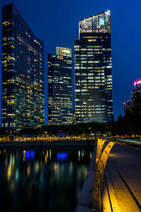 Illuminated buildings in city at night