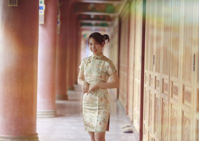 Side view of bride standing in temple