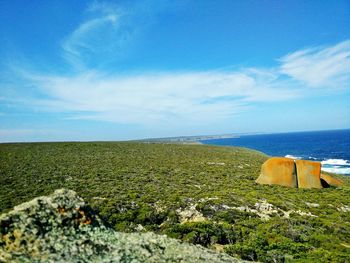 Scenic view of sea against cloudy sky