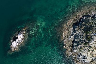High angle view of rocks in sea