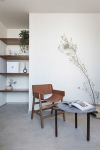 Scandinavian room interior design, with designer armchairs and natural leather style, coffee 