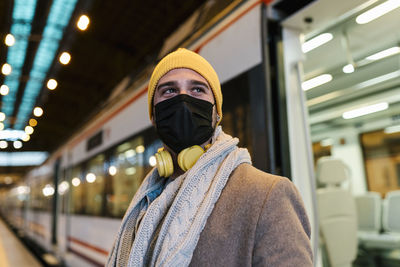 Portrait of man standing in bus