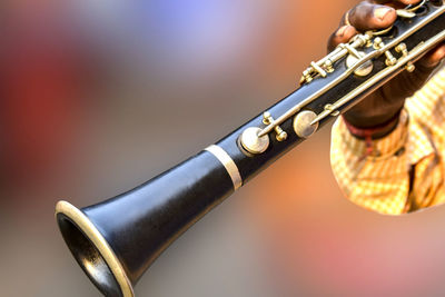 Close-up of person playing piano