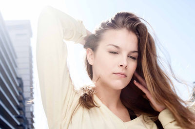 Portrait of smiling young woman looking away