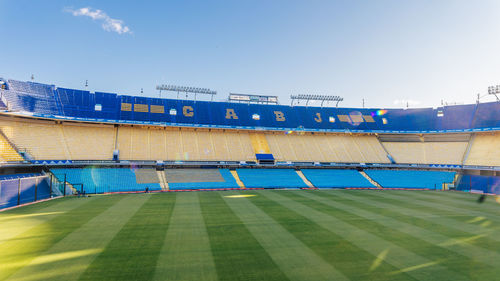 View of empty stadium against clear blue sky