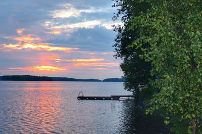 Scenic view of lake at sunset