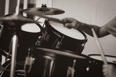 Cropped hands playing drum