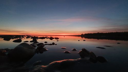 Scenic view of lake against sky during sunset