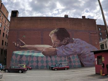 Man in car against building in city