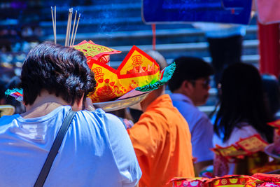 Rear view of people at market