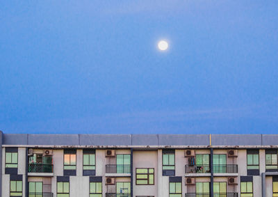 Low angle view of buildings against blue sky