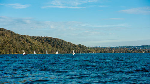 Scenic view of sea against blue sky