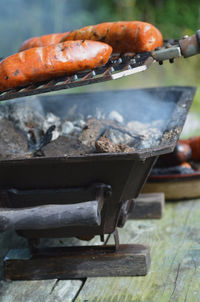 Close-up of sausages being grilled on barbecue