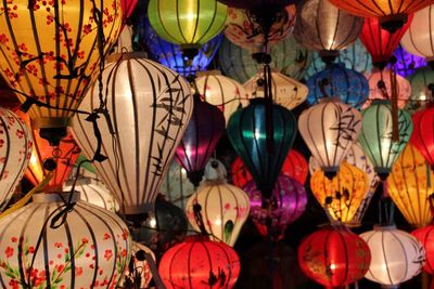 Low angle view of illuminated lanterns hanging in market