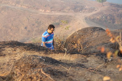 Boy standing on landscape