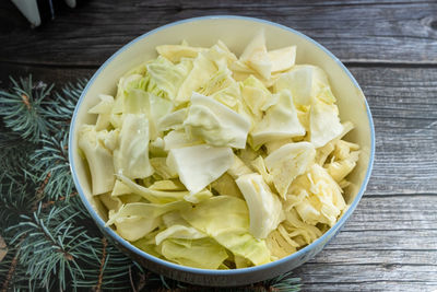 High angle view of chopped vegetables in bowl on table