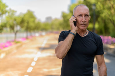 Man standing on mobile phone