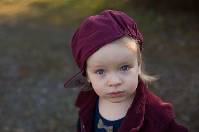High angle portrait of cute boy wearing maroon cap