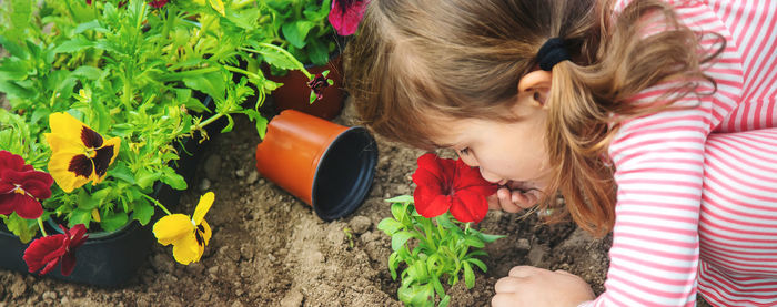 Girl kissing flower