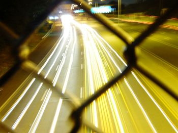 Illuminated tunnel at night