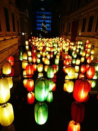 Low angle view of illuminated lanterns hanging at night