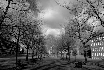 Empty road against cloudy sky