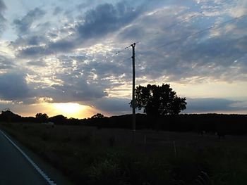 Scenic view of landscape against cloudy sky